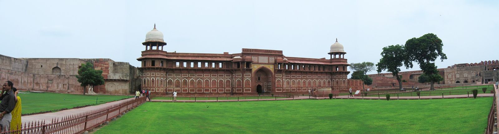 The carved red sandstone facade of the Jahangiri Mahal inside Agra Fort