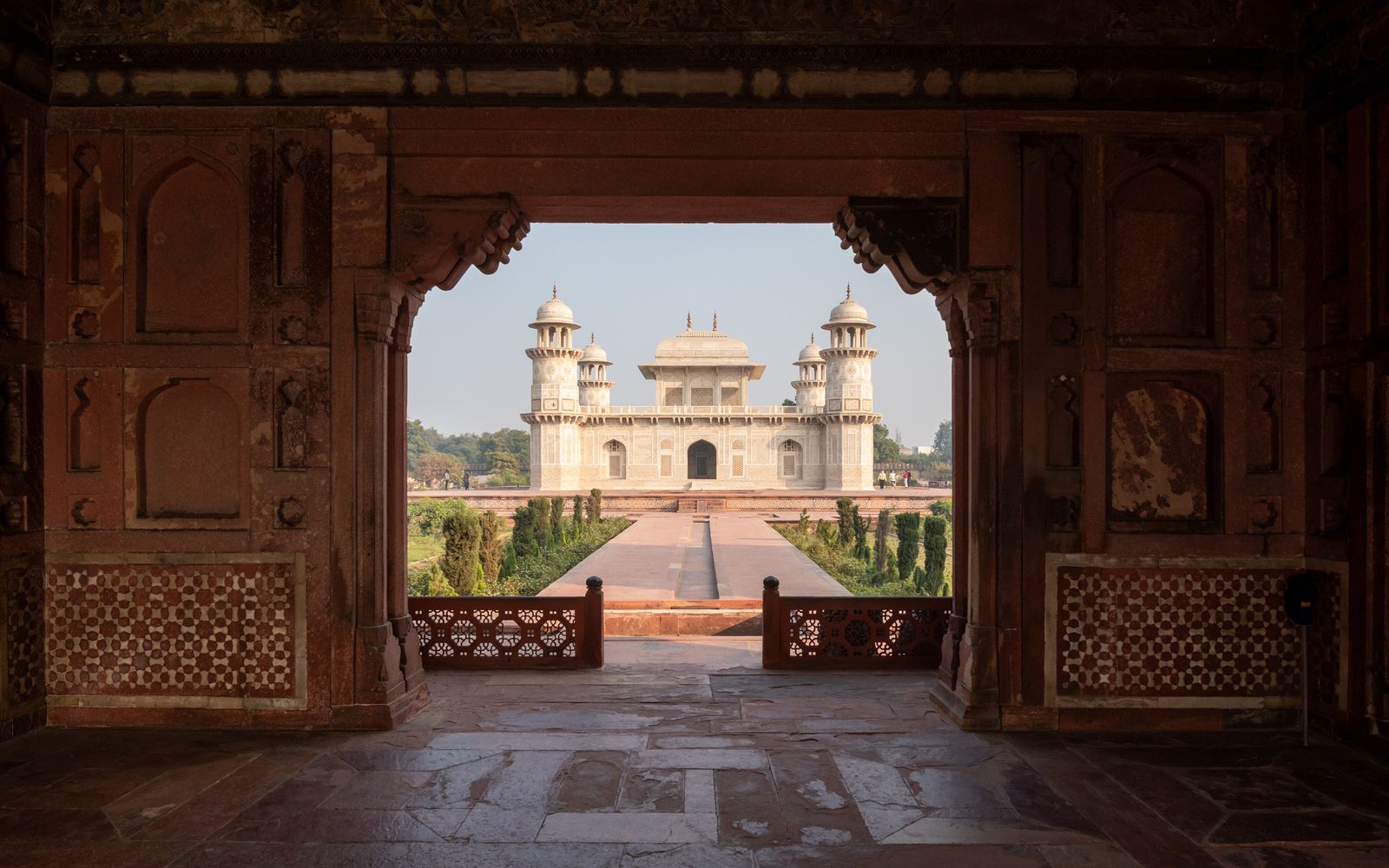 A framed view of the white marble tomb of Itimad-ud-Daulah in Agra