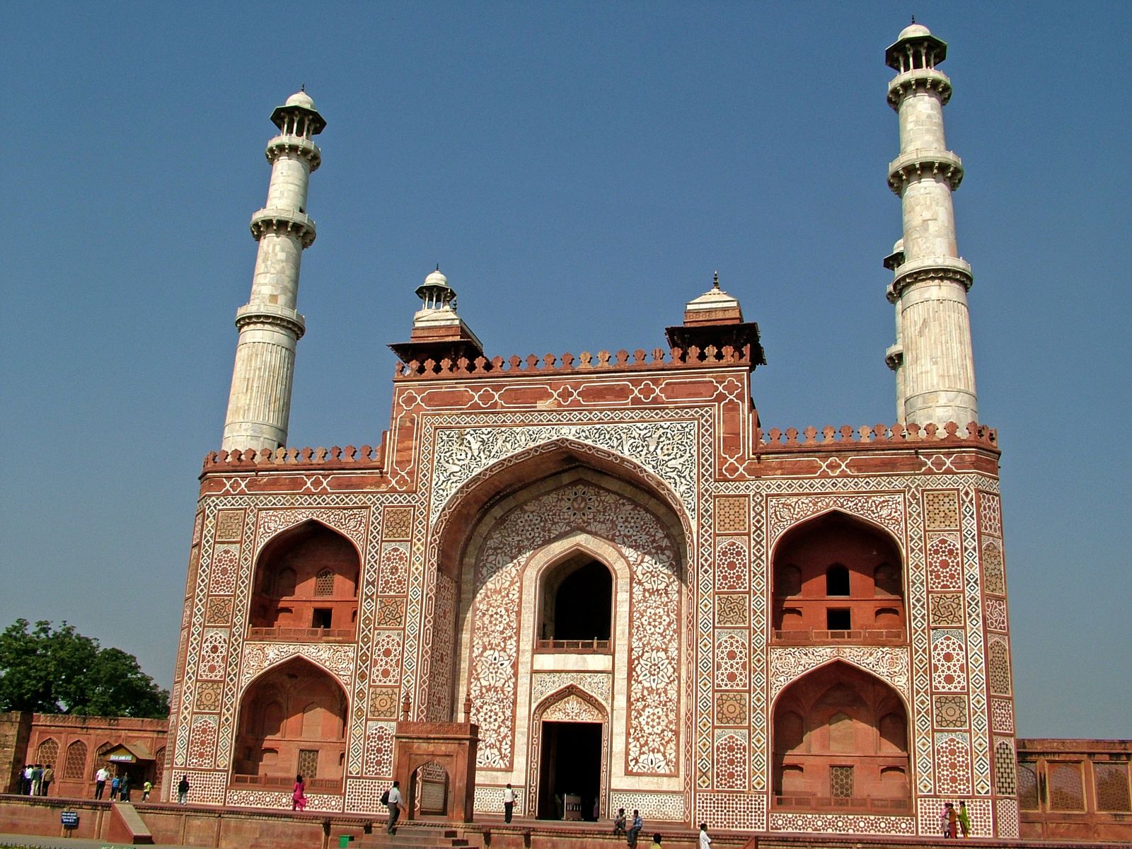 The great inlaid sandstone gateway of Akbar's tomb at Sikandra with its four white marble minarets