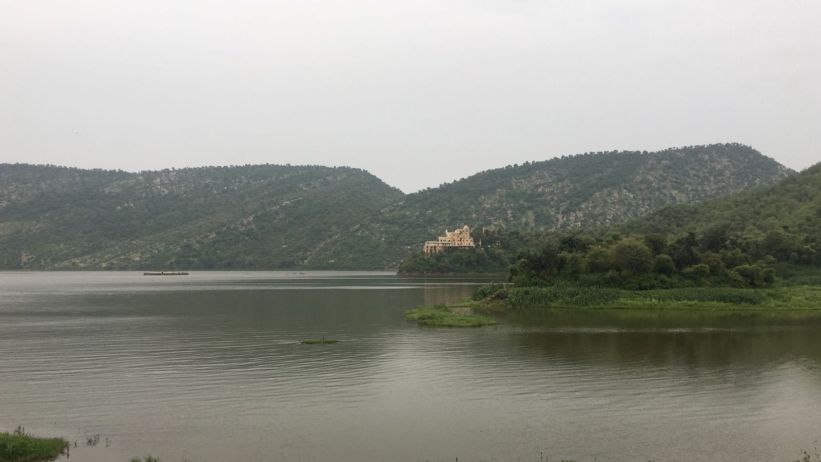 Siliserh Lake among wooded Aravalli hills near Alwar, with the lake palace on its shore