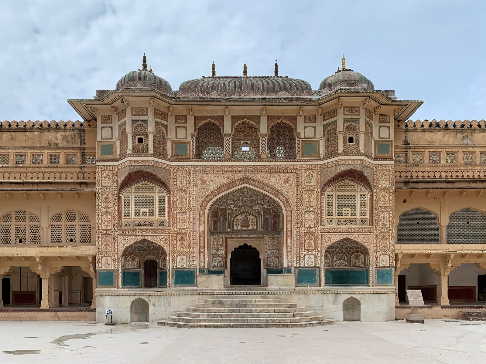 The painted Ganesh Pol gateway with its latticed screens at Amber Fort