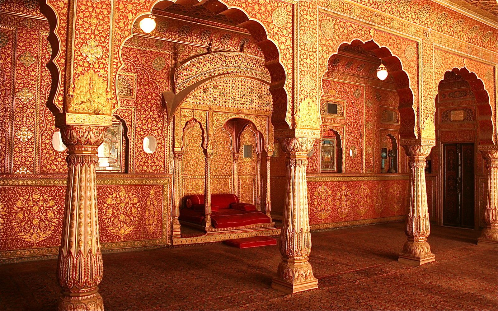 Red and gold painted walls and ceilings inside the Anup Mahal at Junagarh Fort, Bikaner