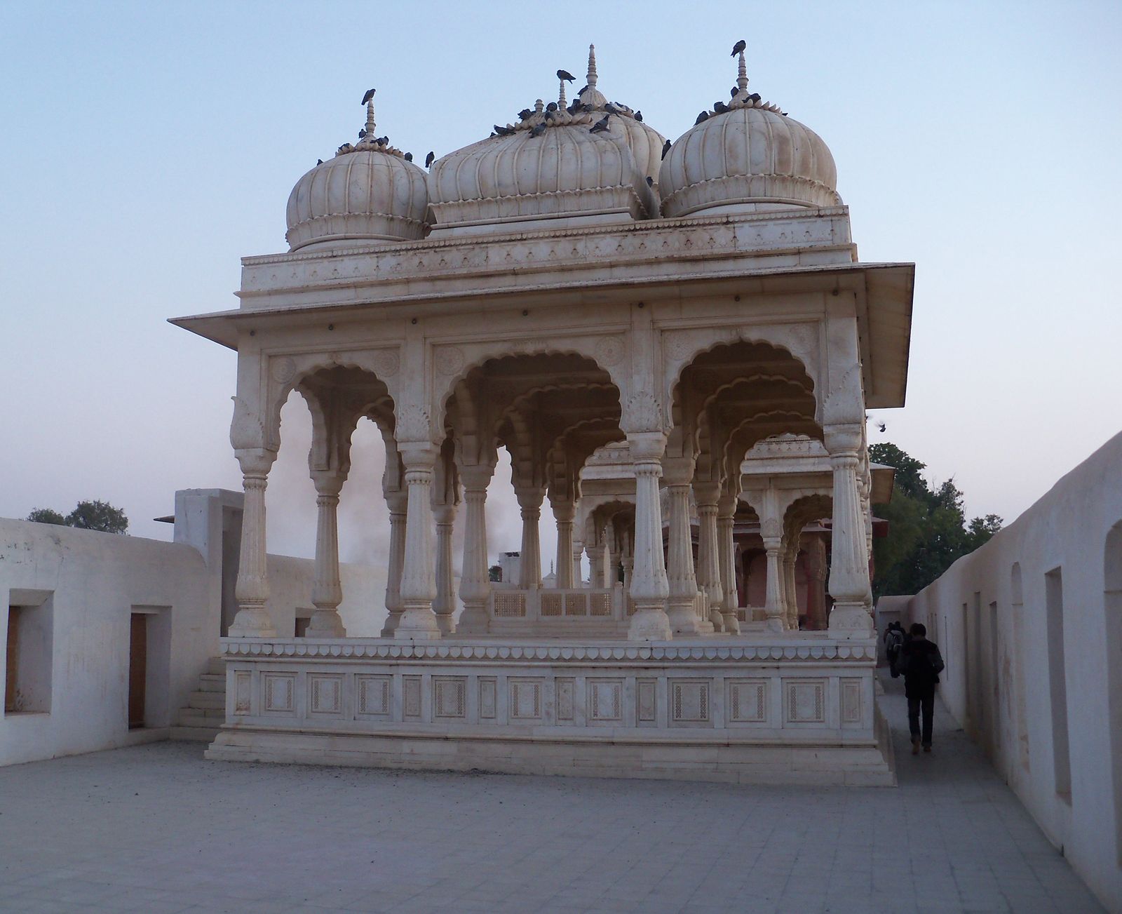 The domed sandstone and marble royal chhatris of Devi Kund Sagar near Bikaner in the late afternoon