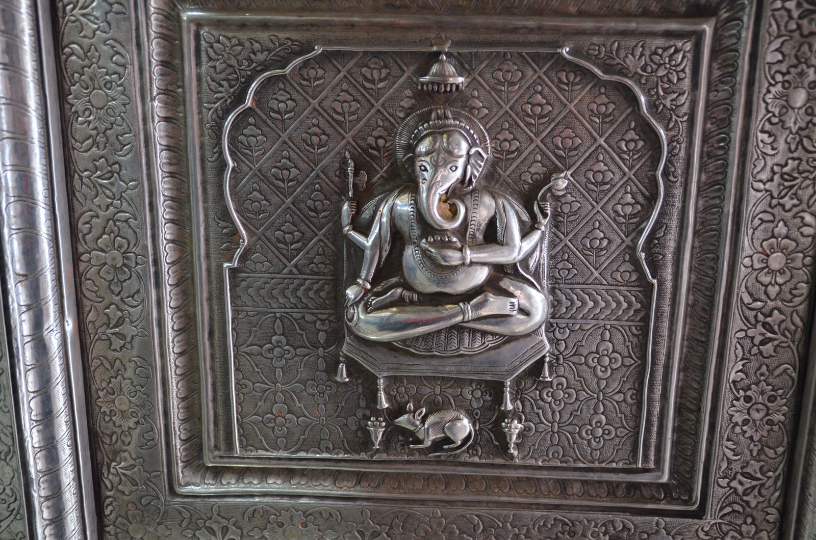 A carved image of Ganesha with his rat mount at the Karni Mata temple in Deshnoke