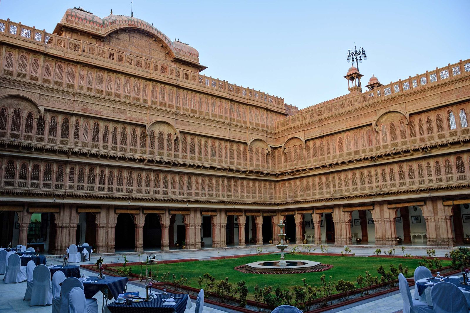 The carved red sandstone courtyard and arcades of Laxmi Niwas Palace within the Lalgarh complex, Bikaner