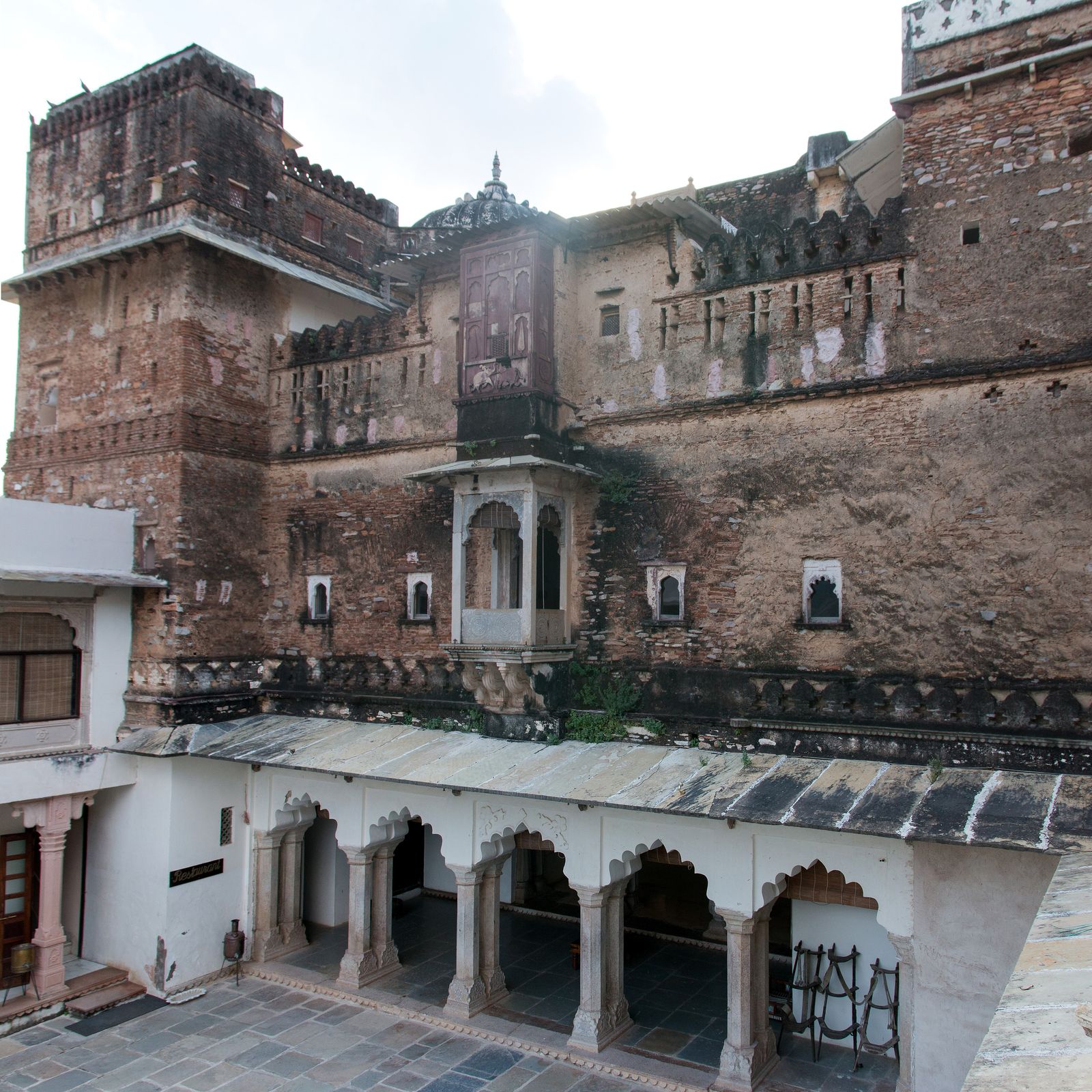 The inner courtyard of Castle Bijaipur with arched verandas around a garden