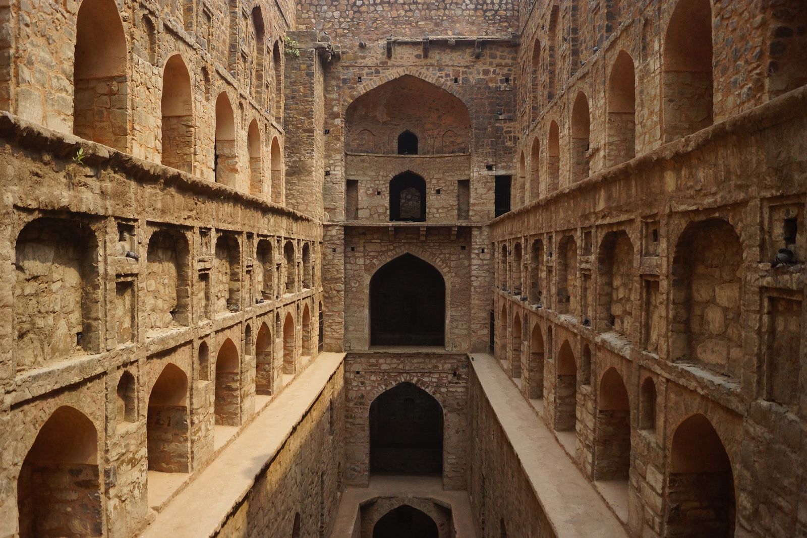 The long stone steps and arched niches of Agrasen ki Baoli, a stepwell near Connaught Place in New Delhi