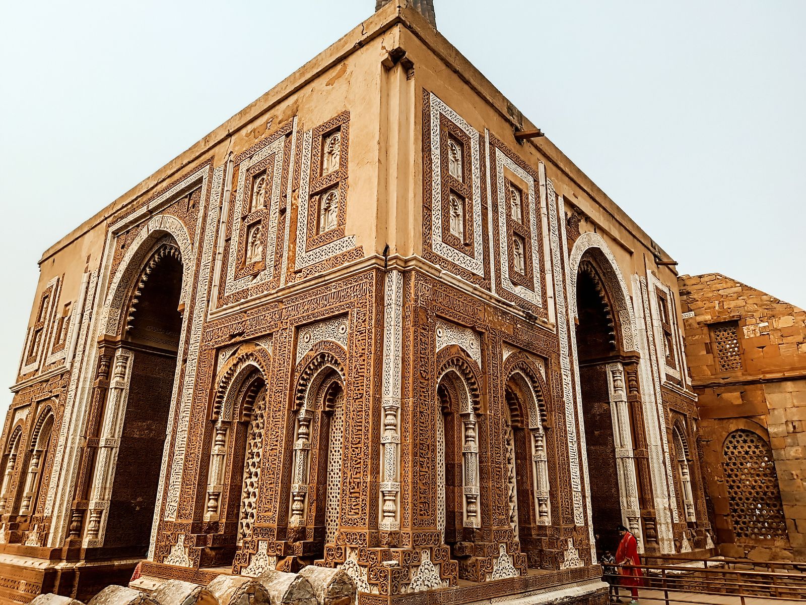 The carved red sandstone Alai Darwaza gateway in the Qutub Minar complex
