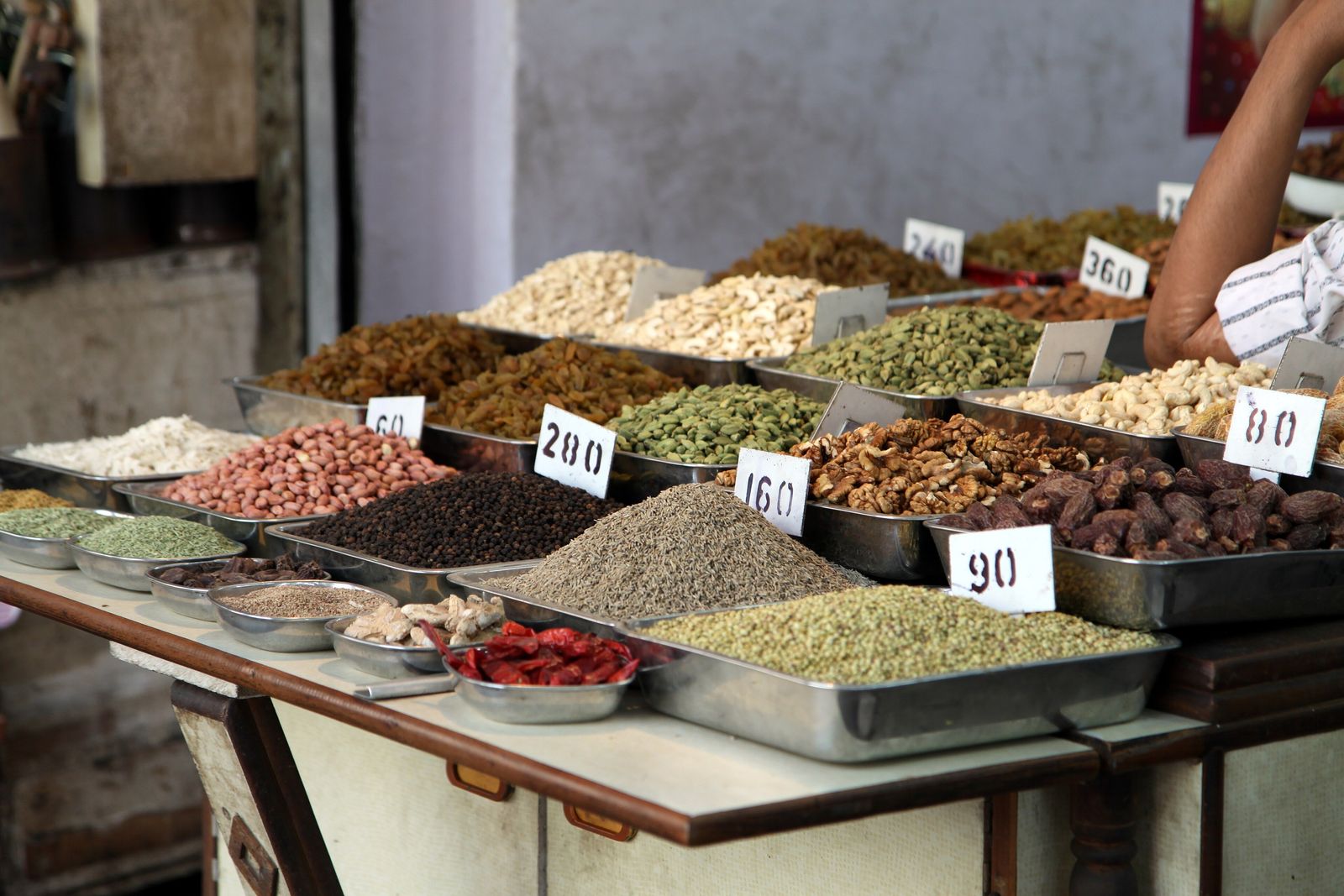 Sacks of dried chillies and spices stacked in front of shops in the Khari Baoli spice market of Old Delhi