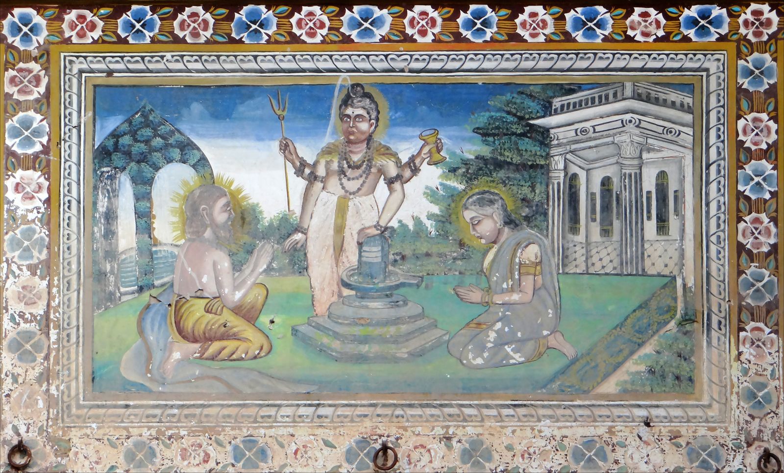 A painted mural of Shiva behind a lingam with two devotees on a haveli wall in Fatehpur