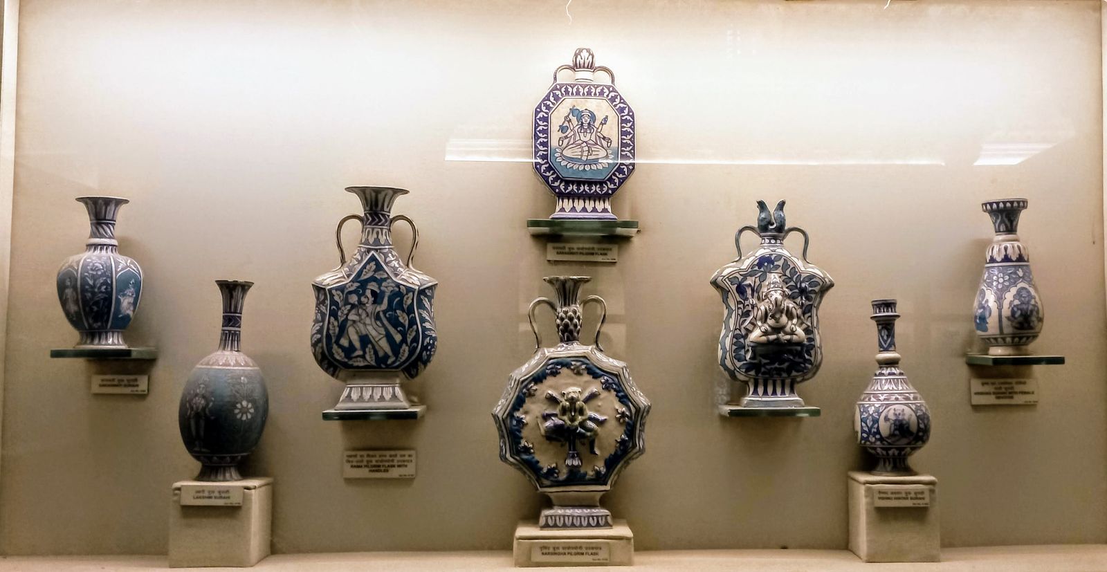 Hand-painted Jaipur blue pottery plates and bowls in cobalt blue and turquoise on white