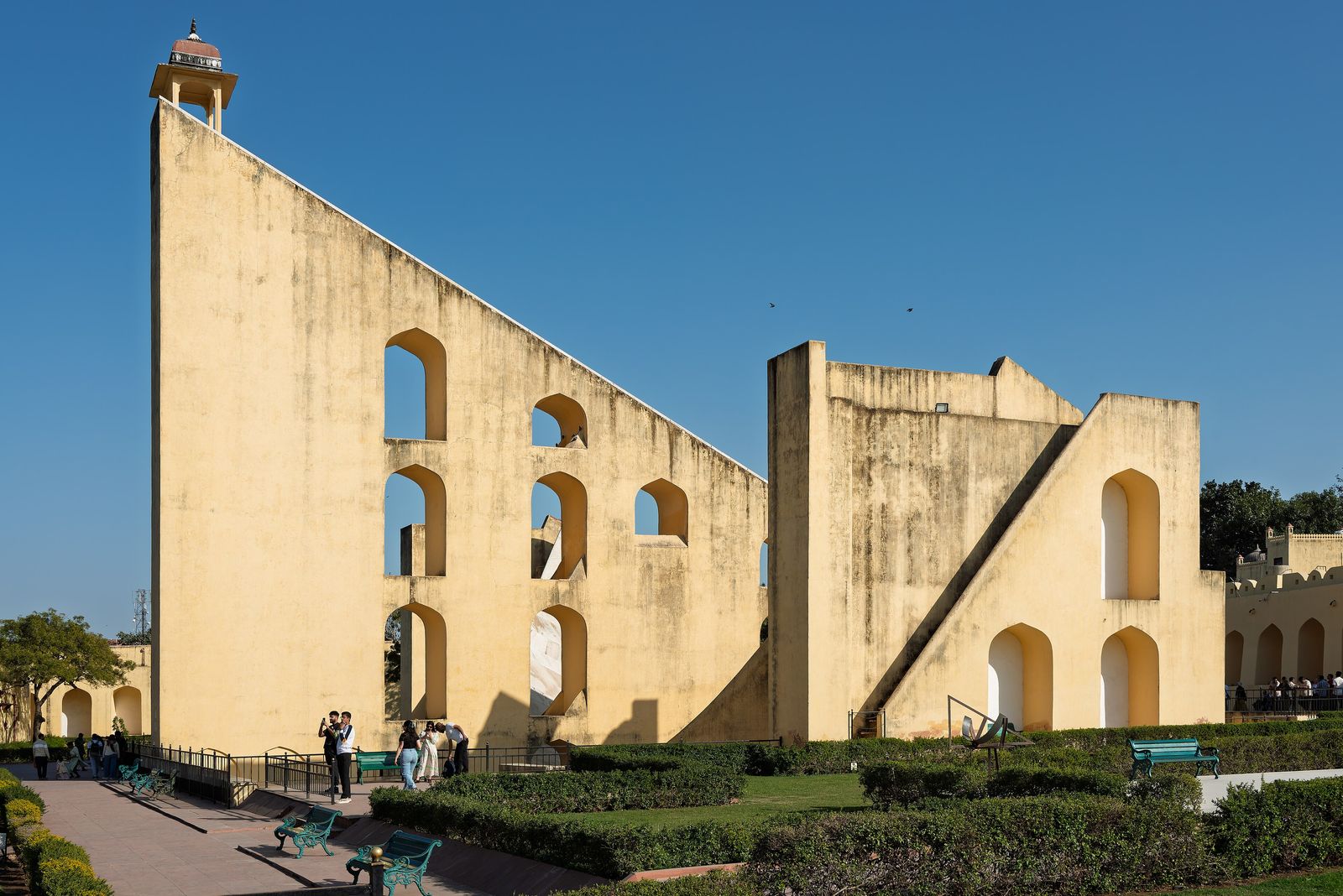 The giant triangular gnomon of the Vrihat Samrat Yantra sundial at the Jantar Mantar in Jaipur against a blue sky