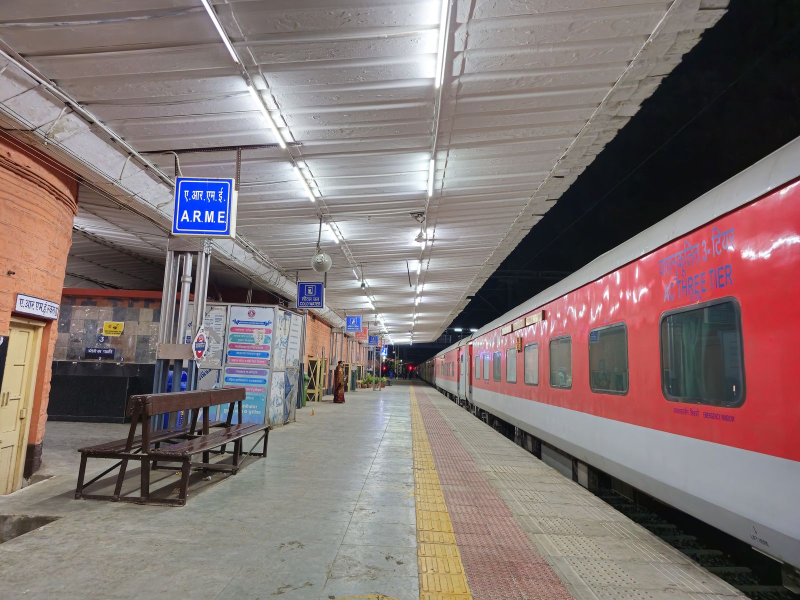 A long-distance train waiting at a railway platform in Rajasthan