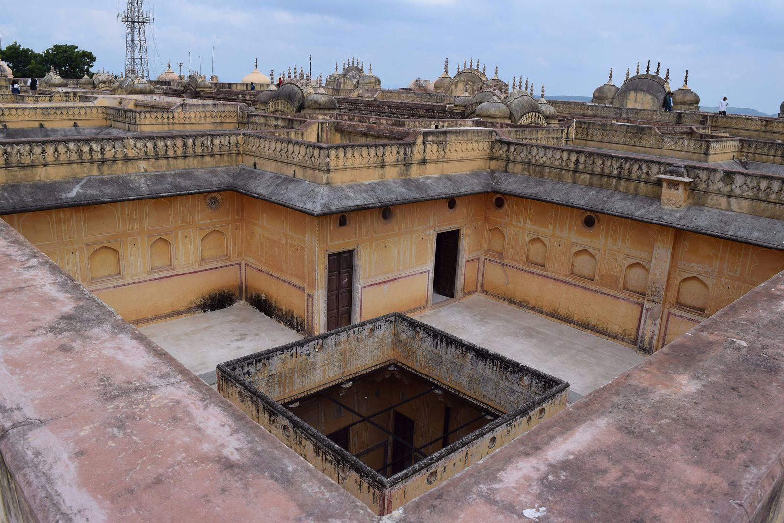 The painted corridors and pale courtyards of the Madhavendra Bhawan palace inside Nahargarh Fort, Jaipur