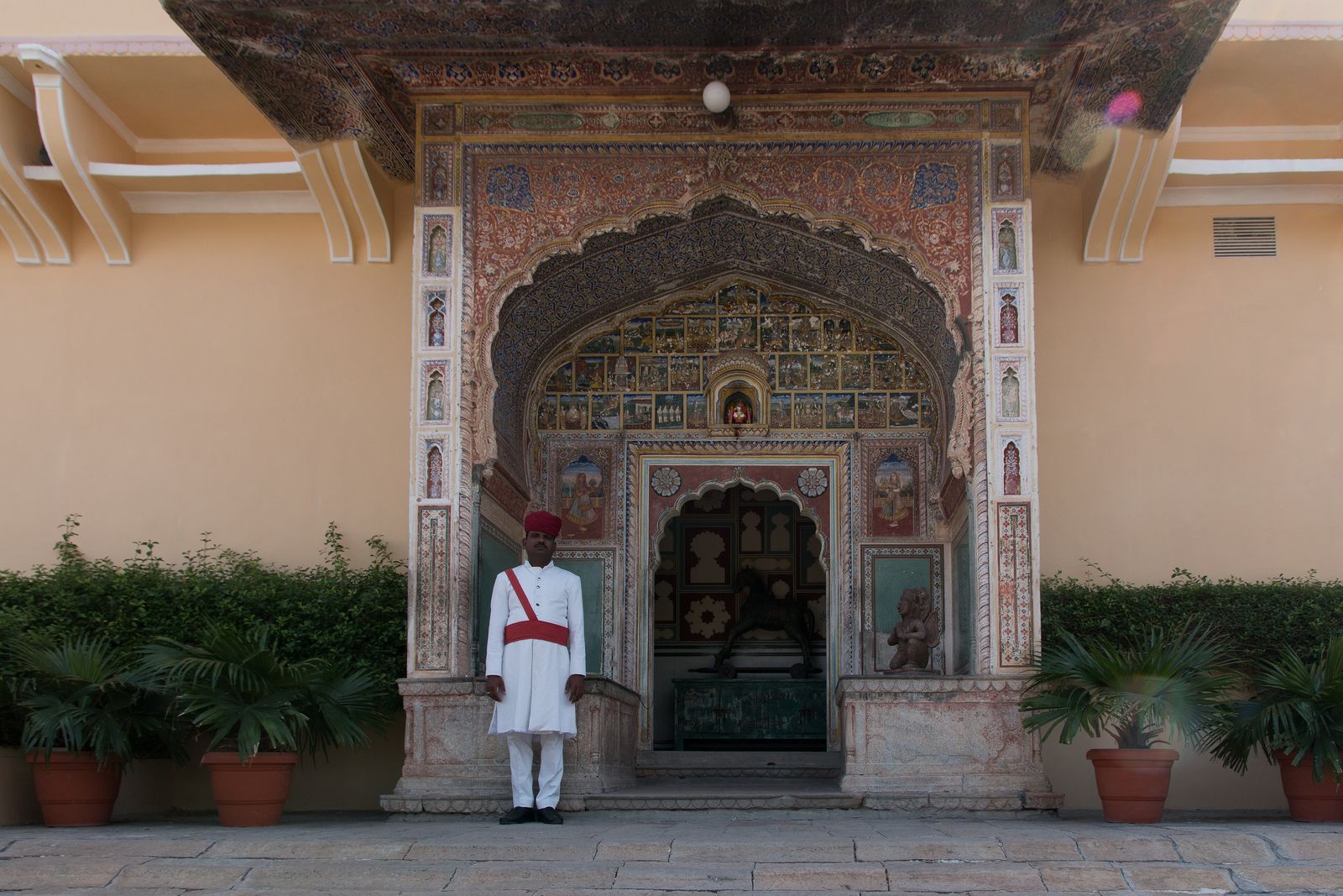 The painted courtyard and arcades of Samode Haveli inside Jaipur's walled city