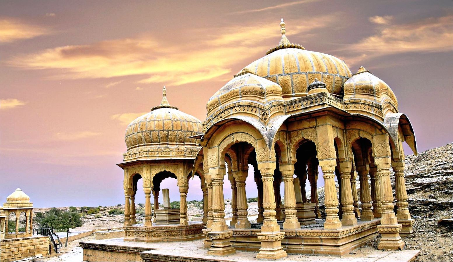 Rows of domed sandstone royal cenotaphs at Bada Bagh on a ridge outside Jaisalmer