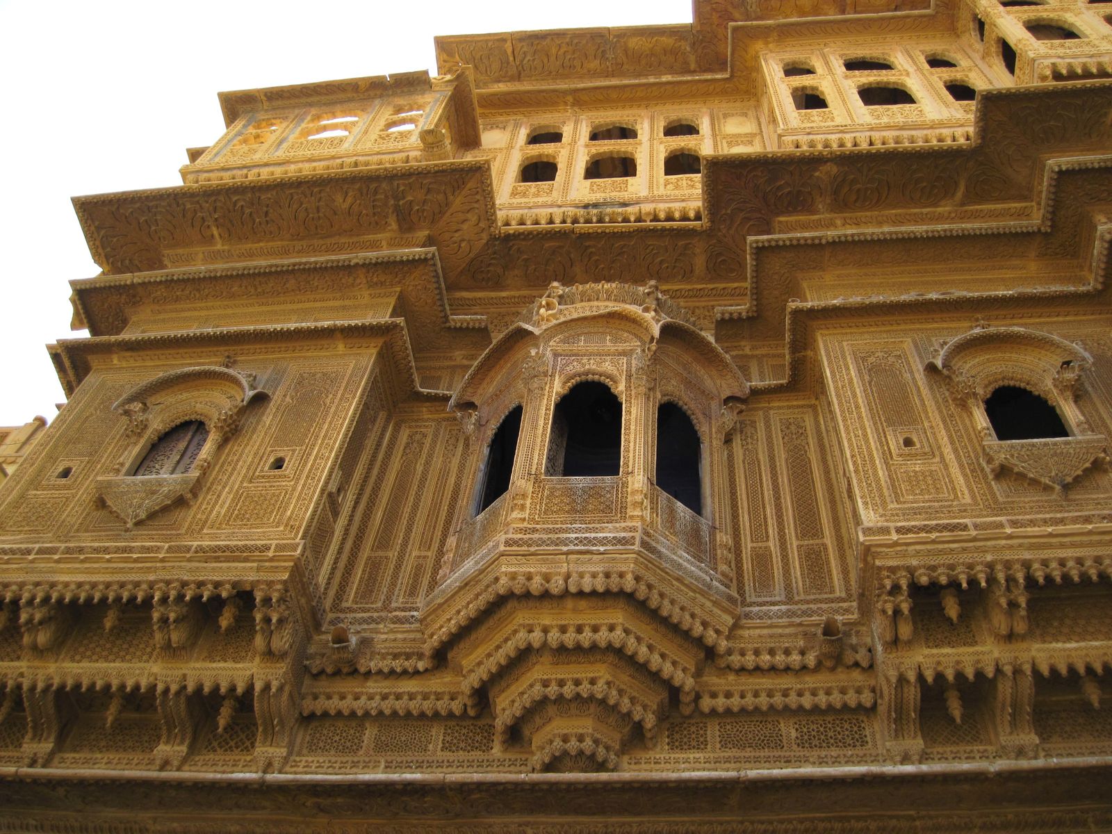 The carved front of Nathmal ki Haveli in Jaisalmer with stone elephants beside the entrance
