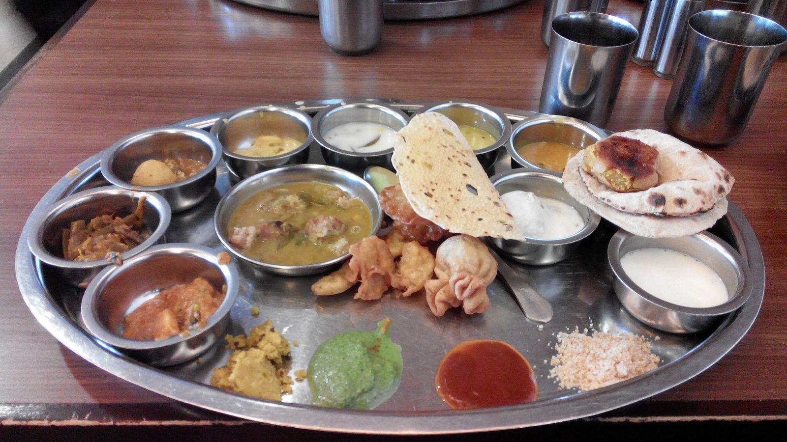 A Rajasthani thali of small bowls of curries, dal and breads
