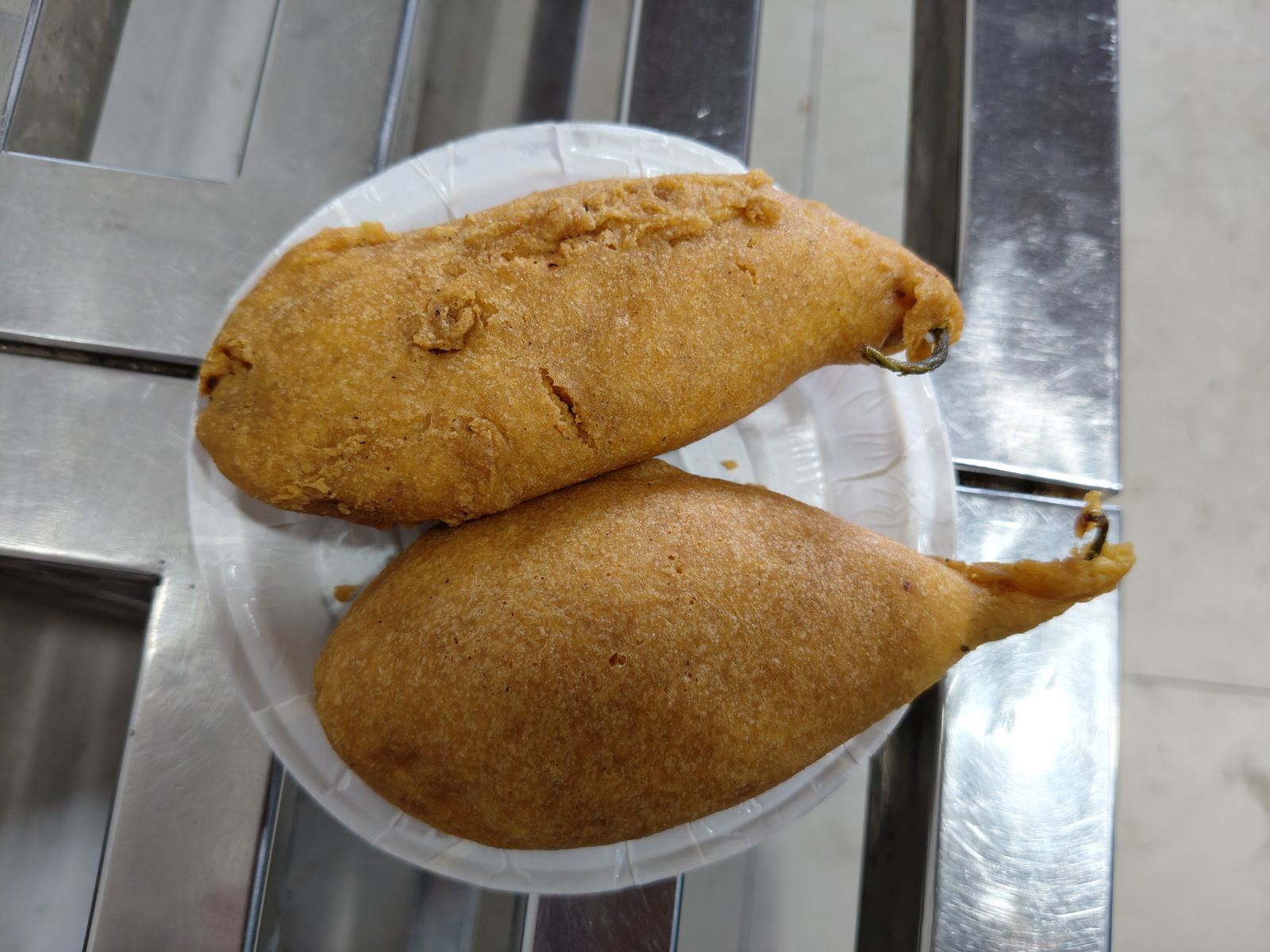 Golden fried mirchi bada, chillies stuffed with spiced potato, from a Jodhpur snack shop