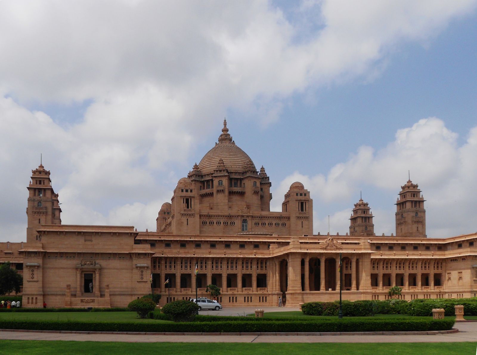 The domed golden sandstone facade of Umaid Bhawan Palace on Chittar Hill in Jodhpur