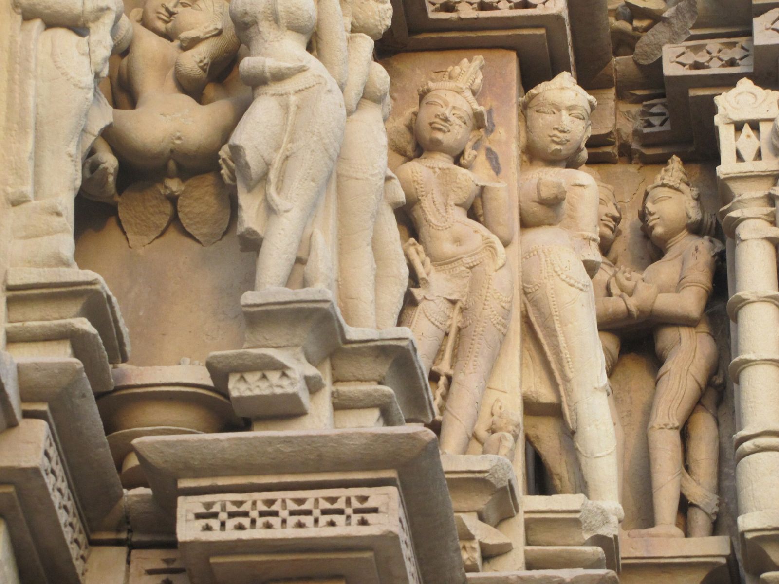 Bands of carved celestial women, deities and animals on an outer wall of a Khajuraho temple