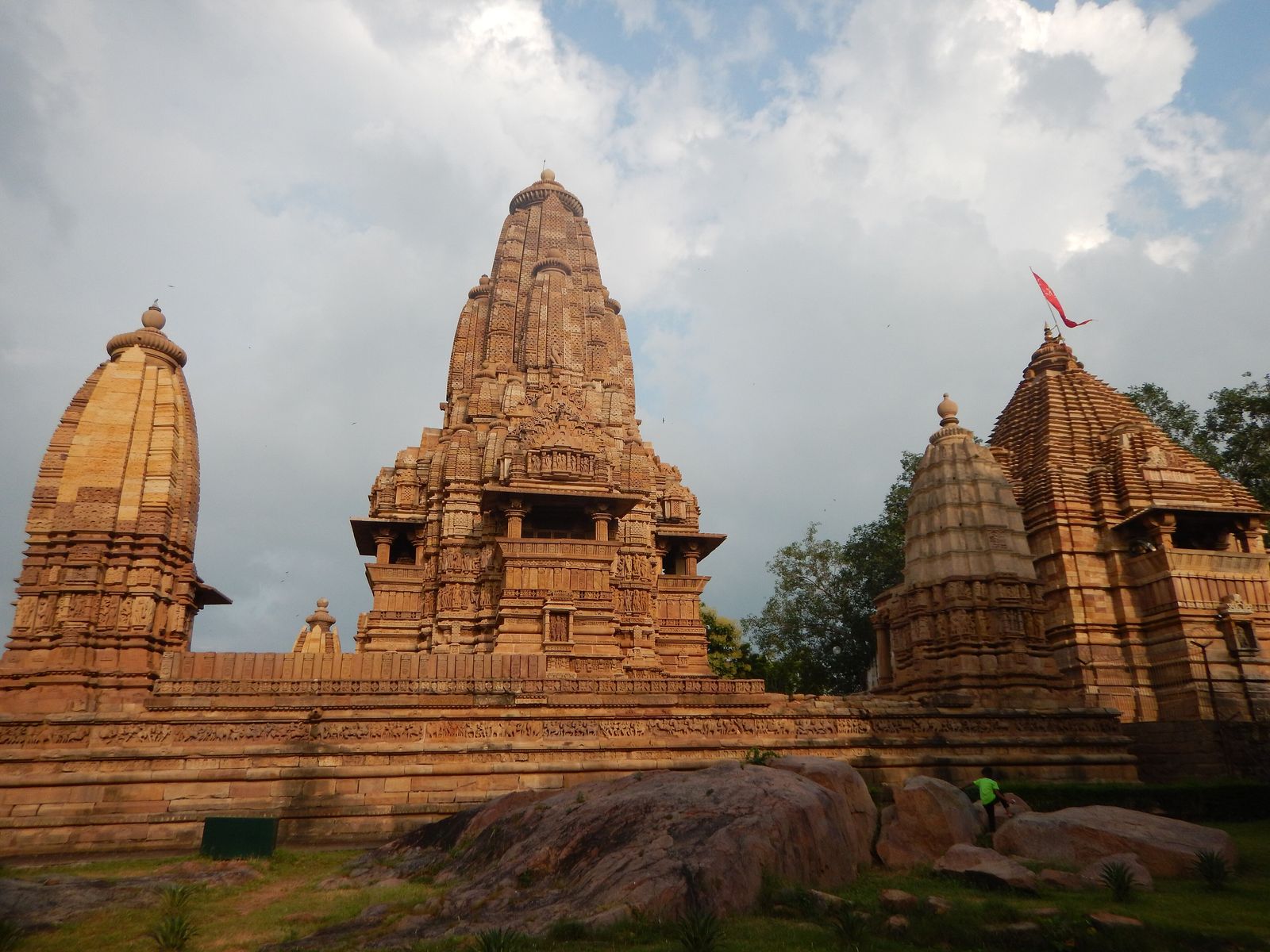 The sandstone temples of the Western Group at Khajuraho rising above lawns and trees