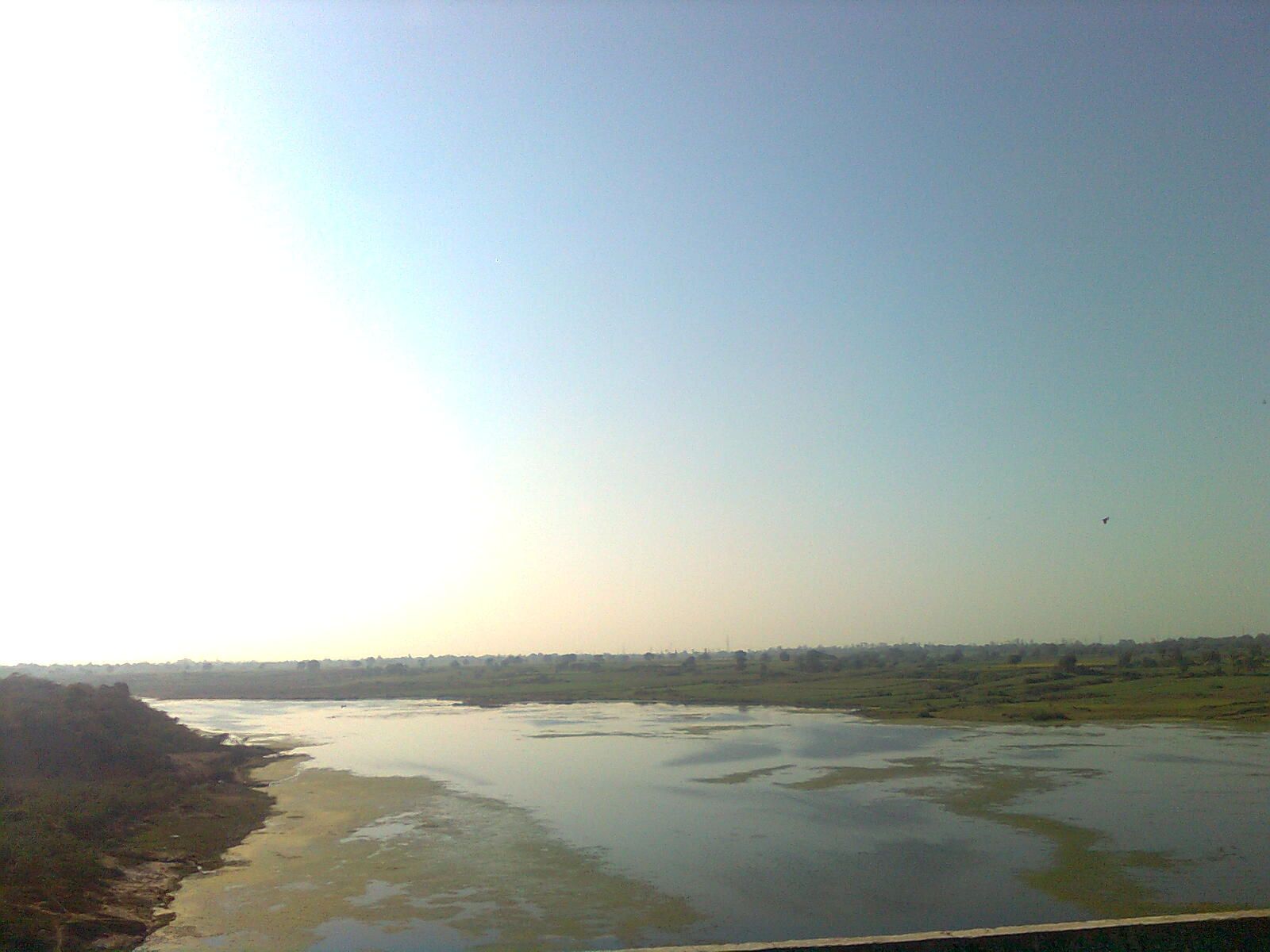 The Chambal river flowing wide and green past the city of Kota