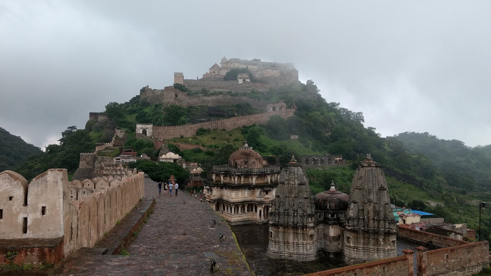 Kumbhalgarh's massive fort wall and round bastions snaking over the green Aravalli hills
