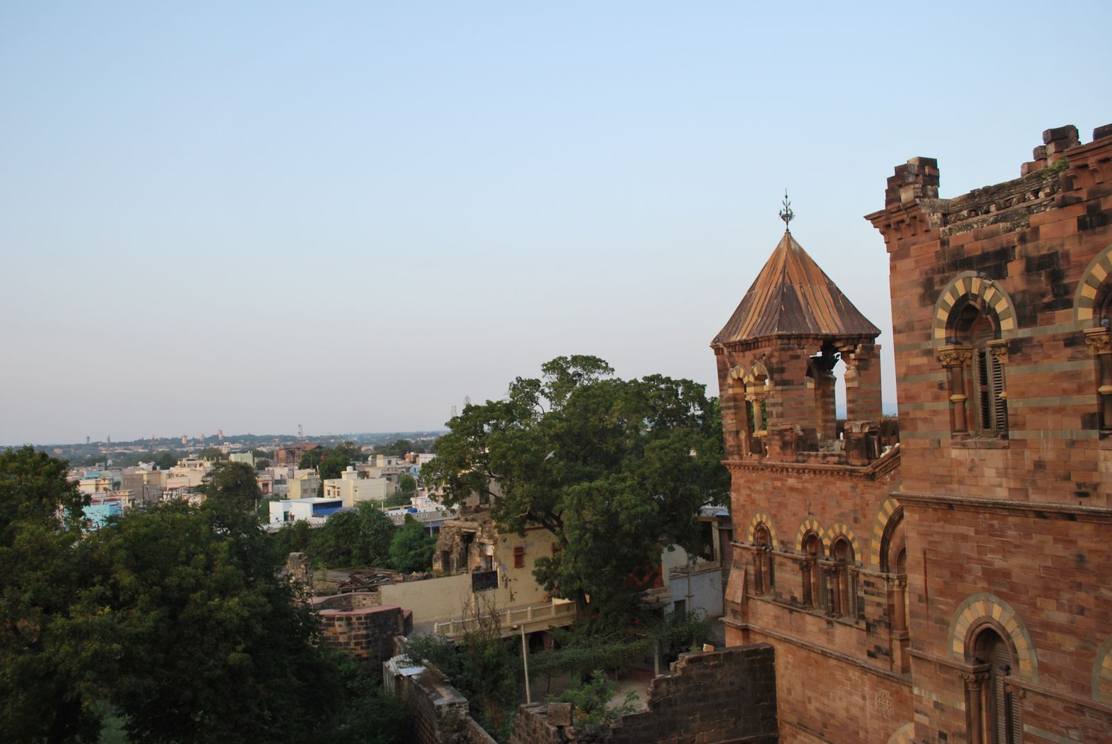 The old city of Bhuj seen from the walls of Prag Mahal, with the palace's red sandstone in the foreground