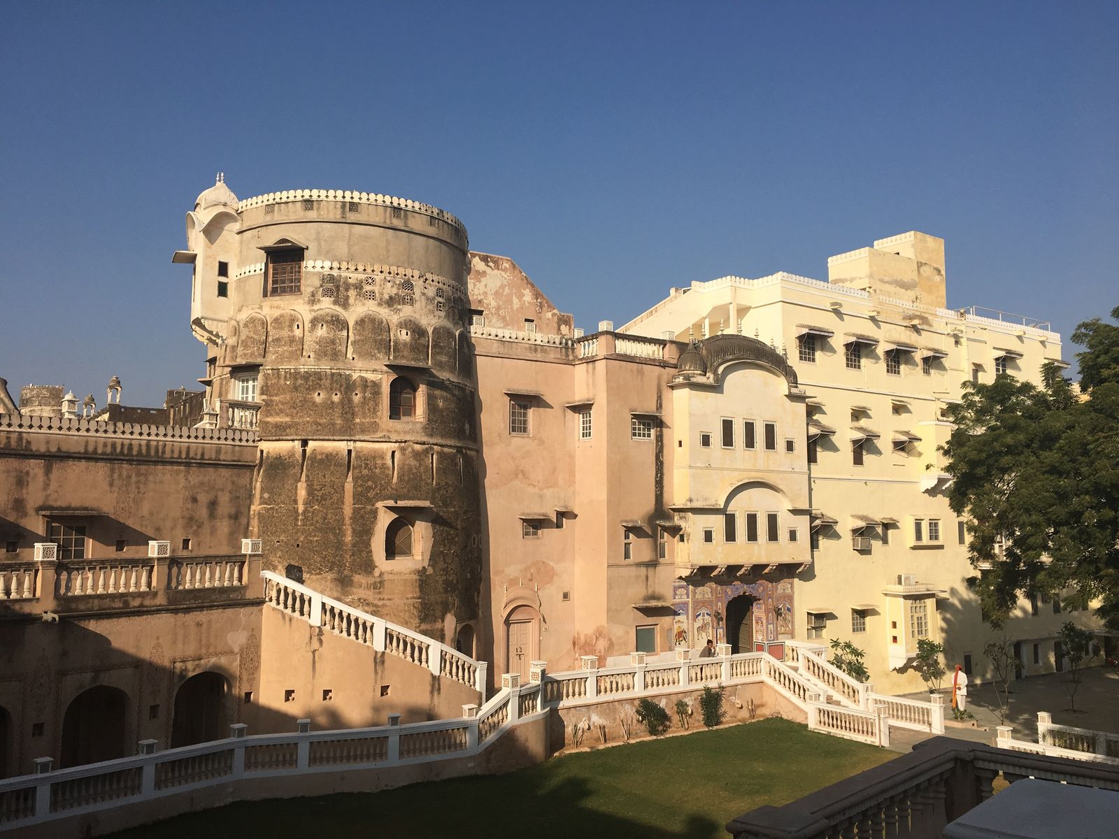 The bastions and painted gateway of Castle Mandawa above the rooftops of Mandawa town