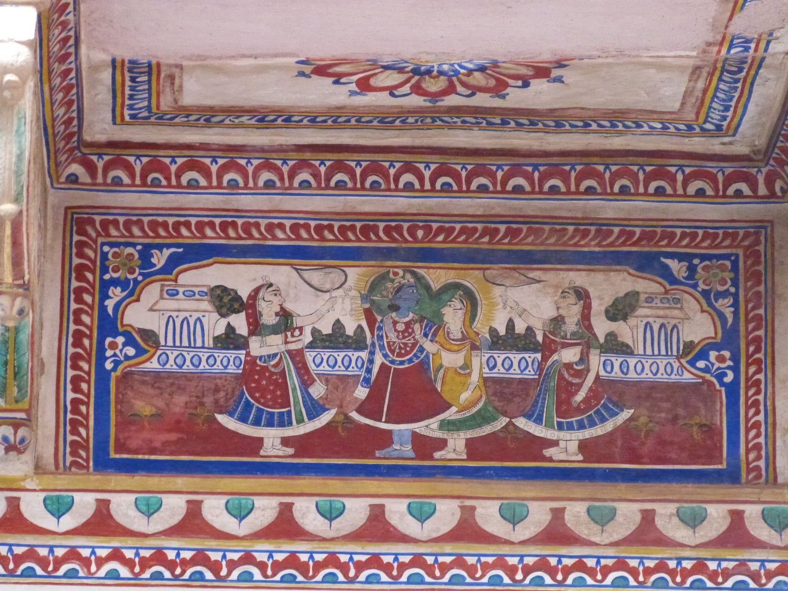 A painted inner courtyard of the Morarka Haveli Museum in Nawalgarh with frescoed arches