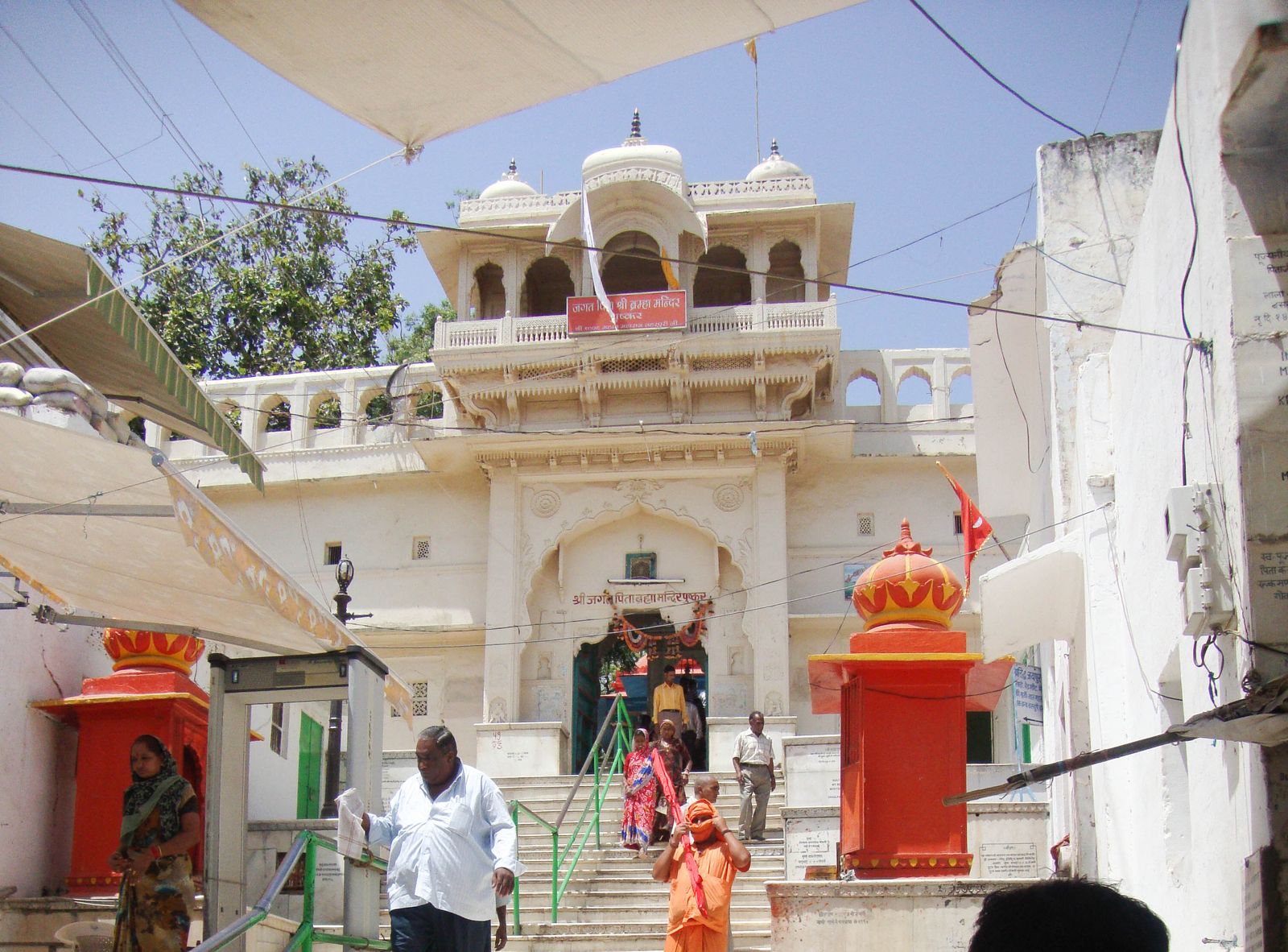 The red spire and marble entrance of the Jagatpita Brahma temple in Pushkar
