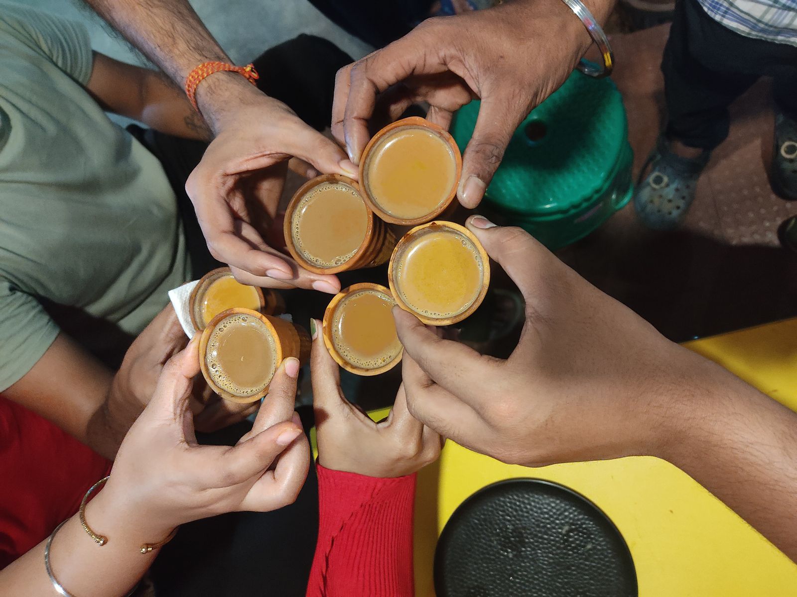 Hot masala chai served in small clay kulhad cups at a tea stall