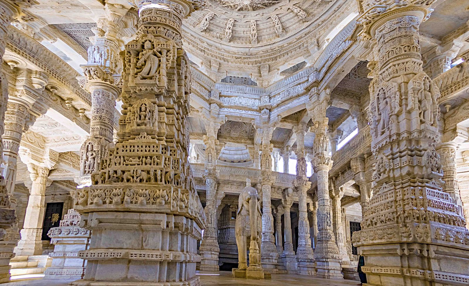 Rows of intricately carved marble pillars inside the Jain temple at Ranakpur