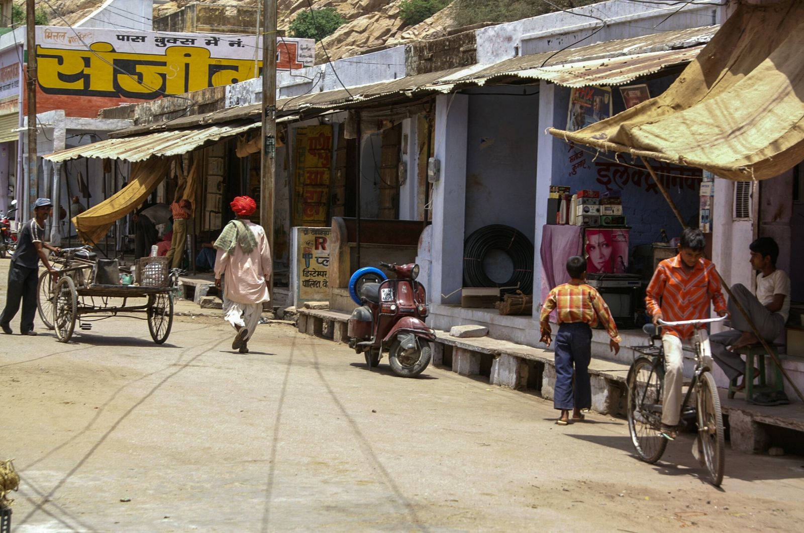 Daily street life in the village of Samode below the palace