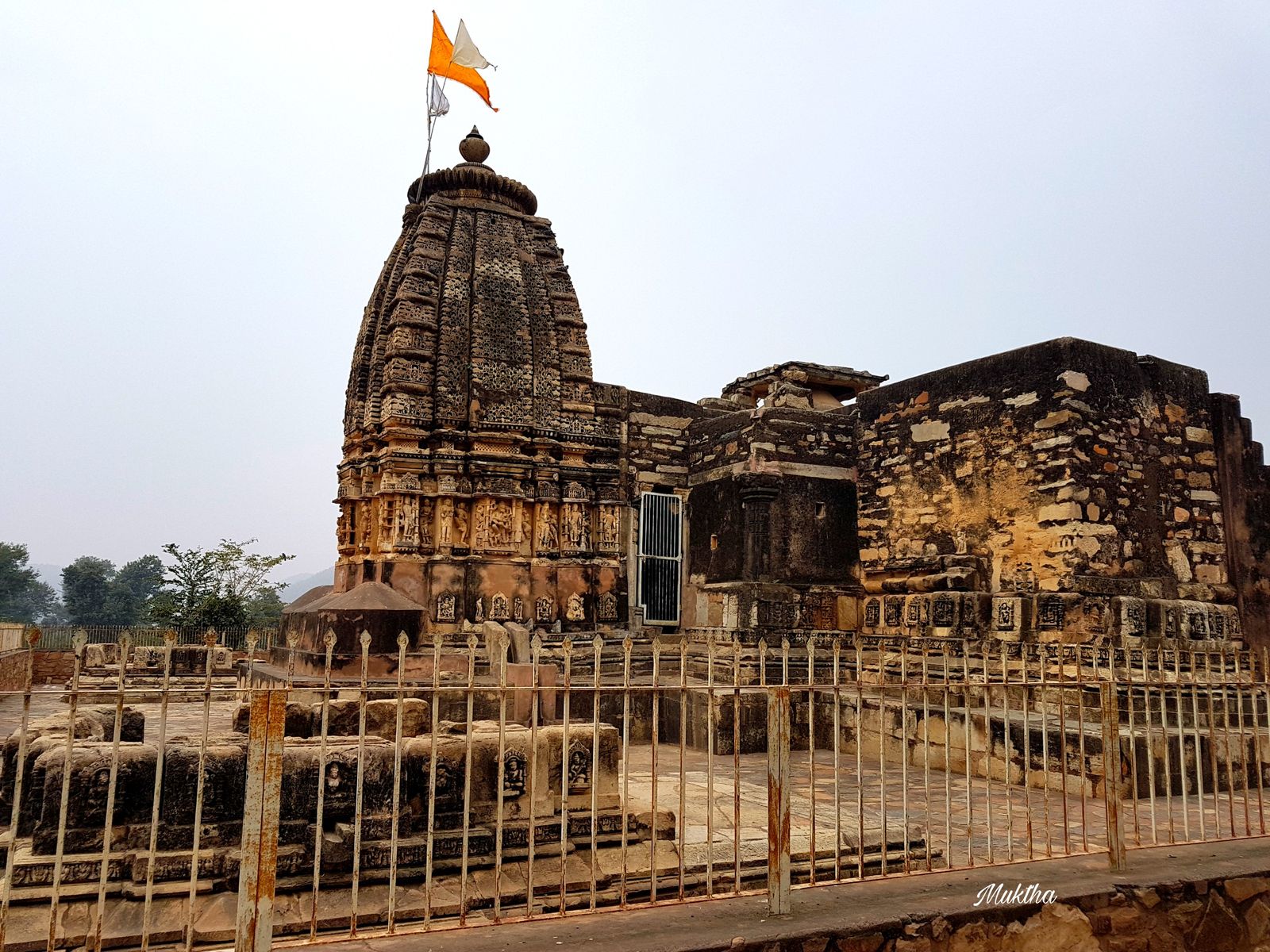 The carved stone Neelkantheshwar temple among ruined shrines on the Neelkanth plateau near Sariska