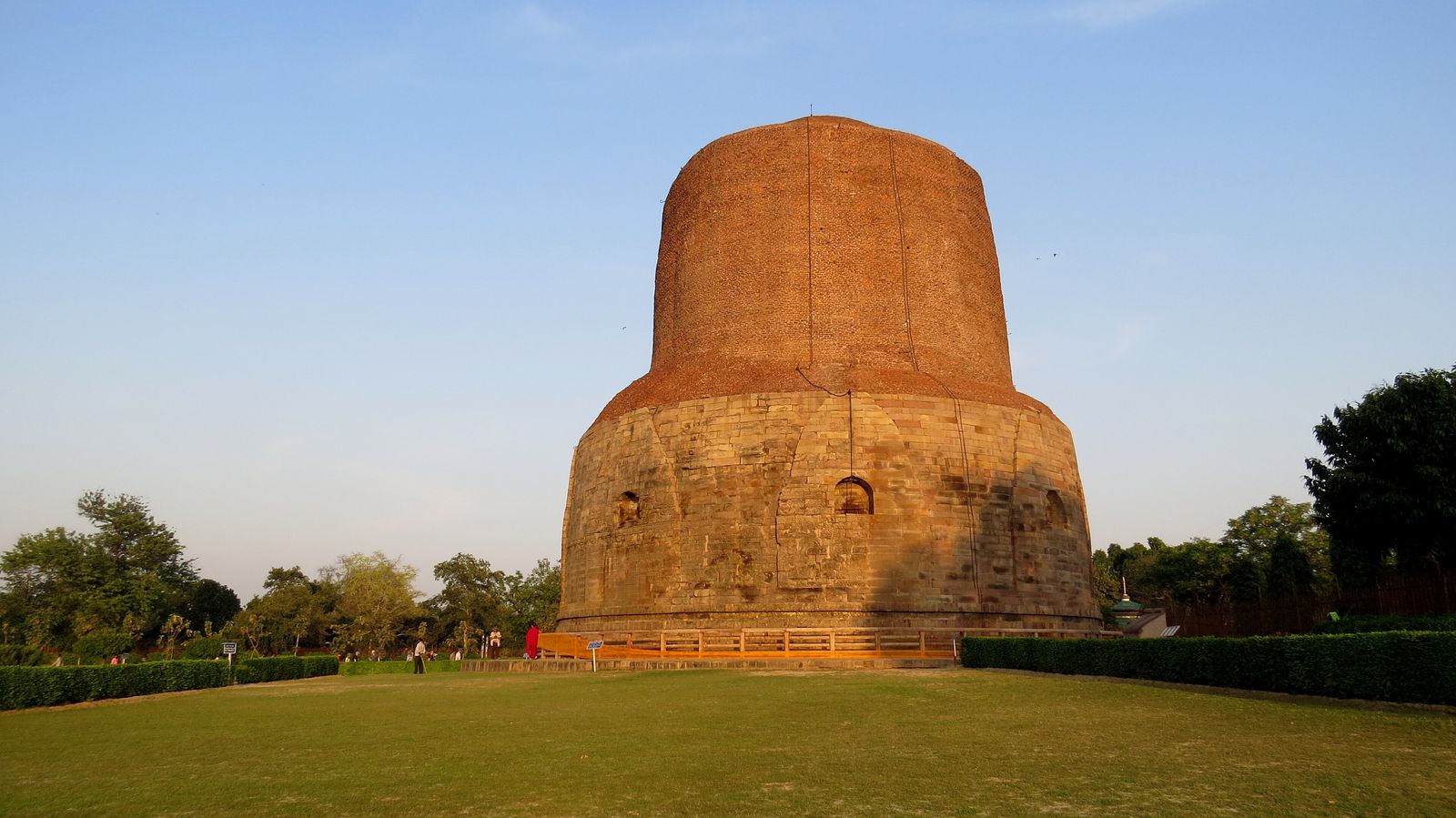 The great brick and stone Dhamek Stupa at Sarnath surrounded by lawns