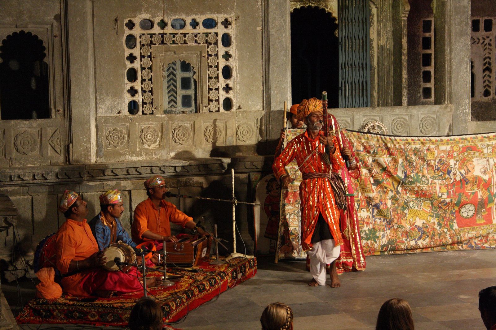 A folk performer telling a story in dance during an evening show in the courtyard of Bagore ki Haveli in Udaipur