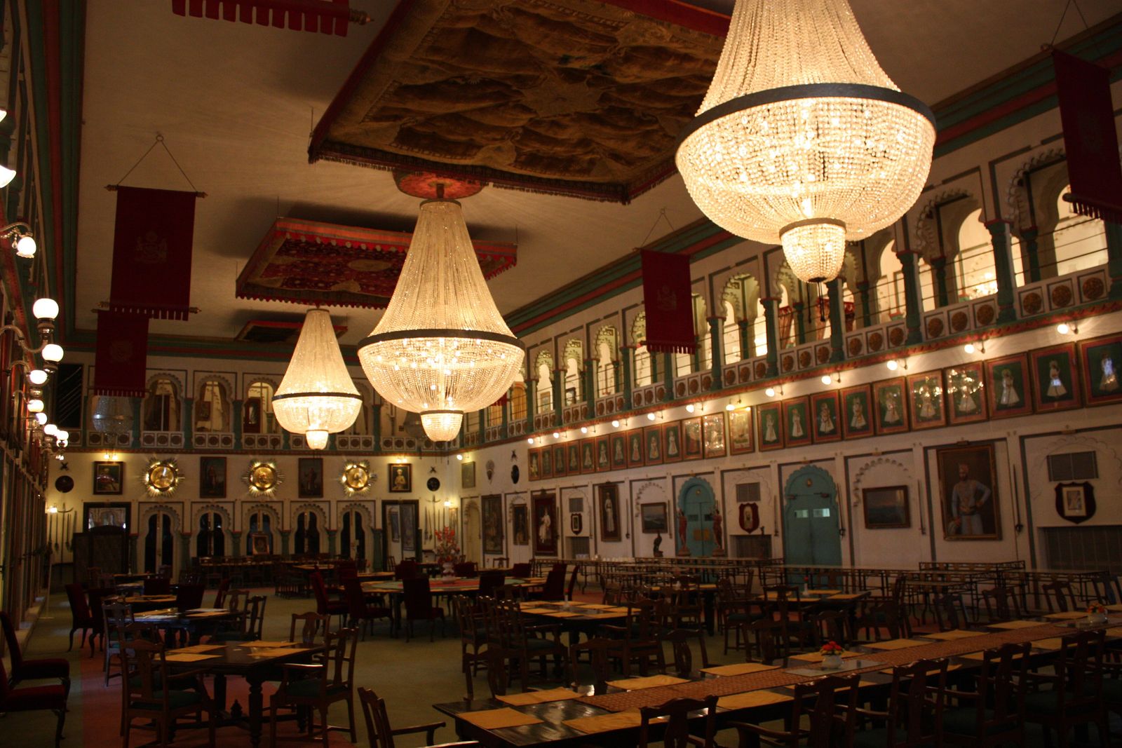 The Durbar Hall of Fateh Prakash Palace in Udaipur, with chandeliers hanging from a high ceiling