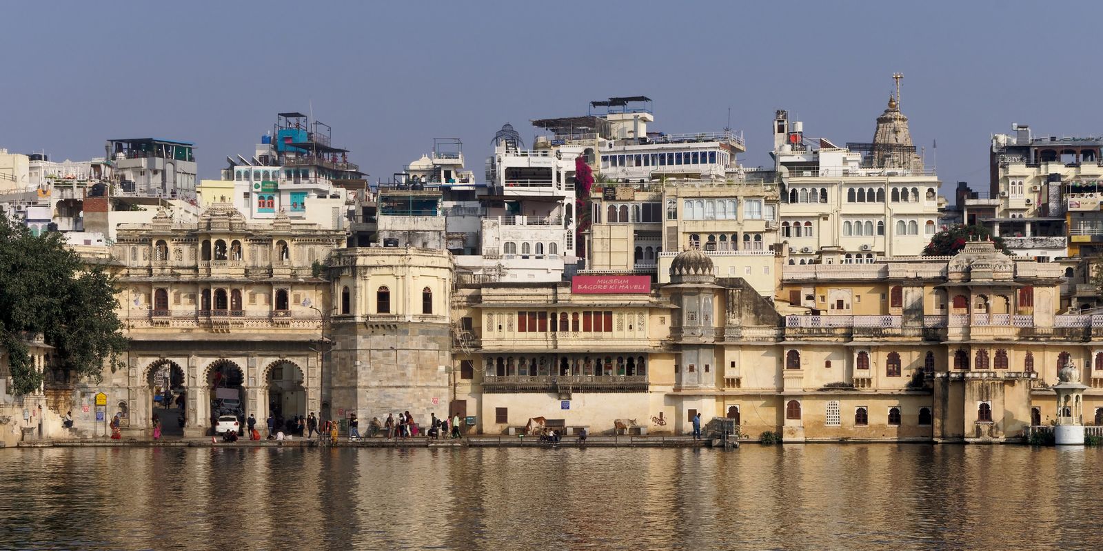 Gangaur Ghat with its triple-arched gate beside Bagore ki Haveli on Lake Pichola in Udaipur