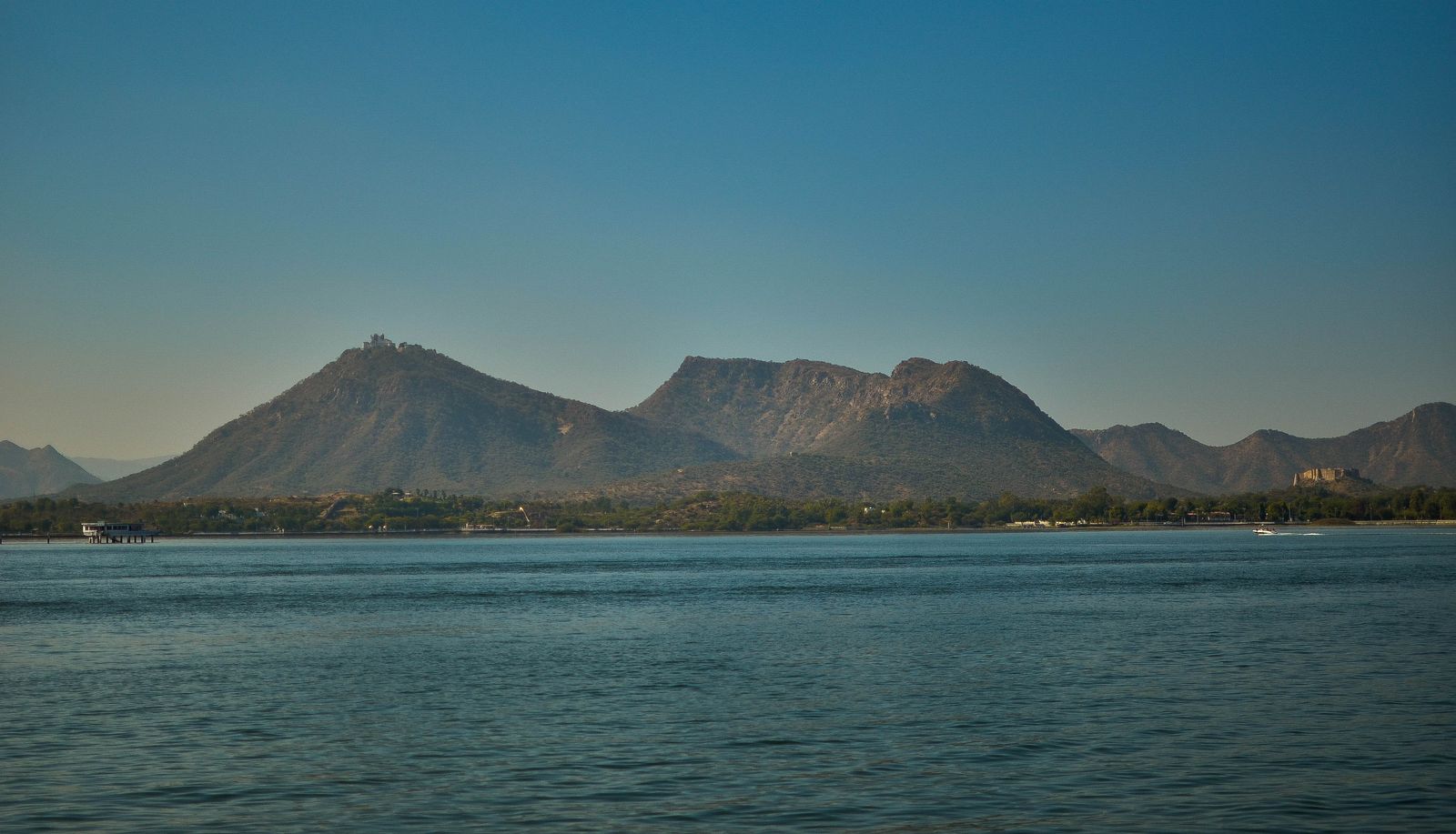 Fateh Sagar Lake in Udaipur, with the Sajjangarh Monsoon Palace on its hilltop in the distance