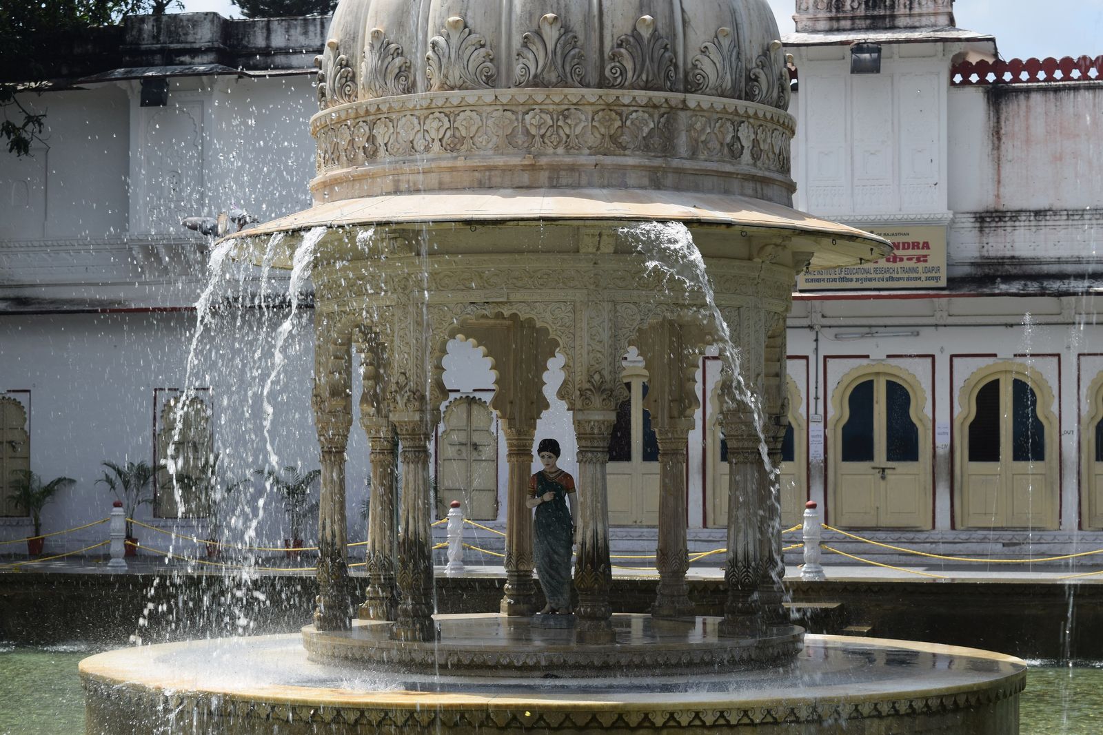 Fountains playing in the lotus pool of Saheliyon ki Bari in Udaipur, with marble elephants at the corners