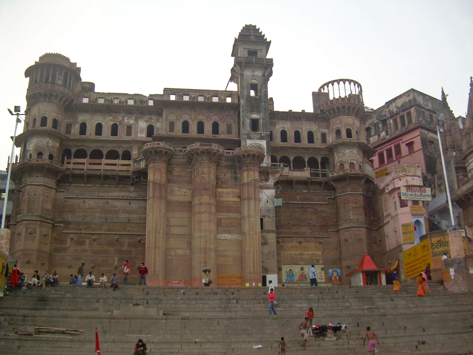 The tall sandstone front of the riverside mansions on Darbhanga Ghat, Varanasi, seen from the Ganga
